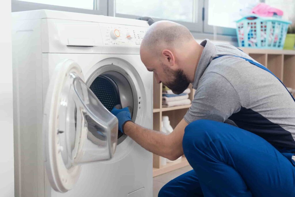 professional repairman fixing a washer 2026 01 07 05 49 54 utc scaled 1